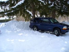 The blazer near a snow bank.