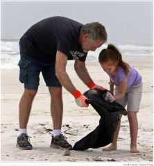 Glenn Corbett & 5 year old grandaughter joined hundreds of volonteers picking up trash along Escambia County Fla beaches 5/2/10 
Cleaning debris now can make an oil cleanup easier